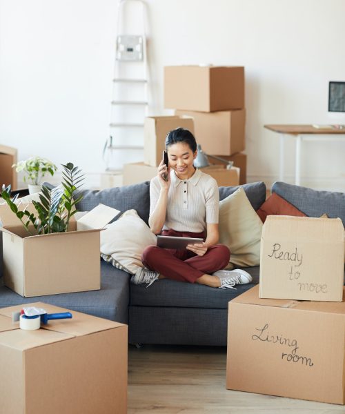 young-asian-woman-calling-moving-services.jpg